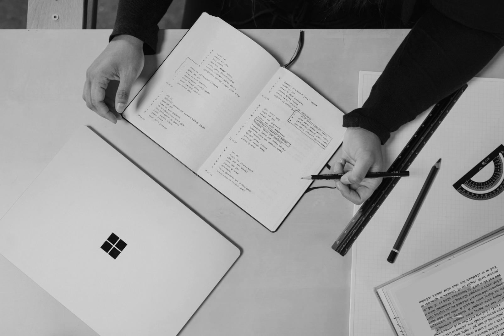 Group of students collaborating on budget planning exercise during workshop session