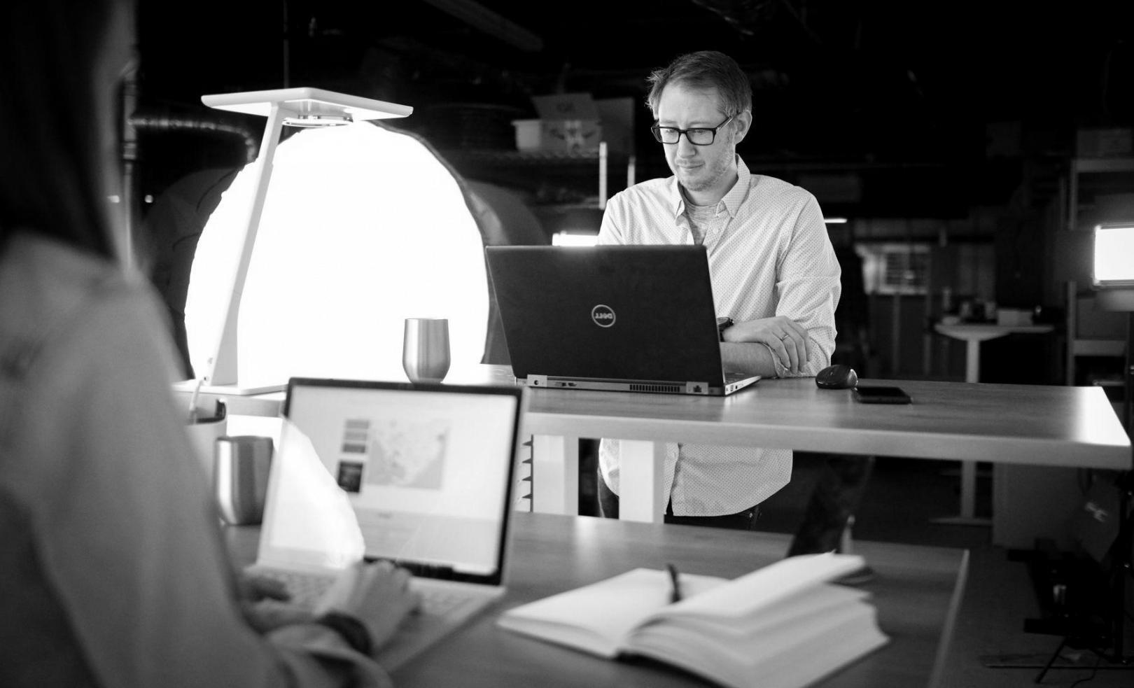 Financial planning materials and calculators spread across table during budget consultation